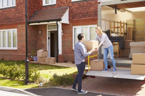 A local removals team managing access and loading for a property move in Belsize Park