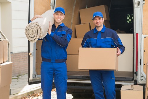 Local house removal team moving furniture in Belsize Park