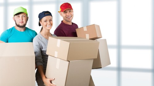 Removal team planning a home move on a Belsize Park residential street