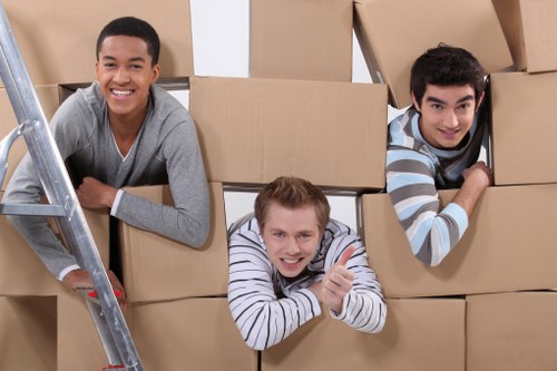 Furniture and boxes being loaded into a moving van in Belsize Park
