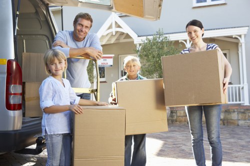 Packed moving boxes and furniture ready for flat removals in Belsize Park