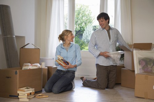 Organised moving boxes labeled by room during a Belsize Park relocation