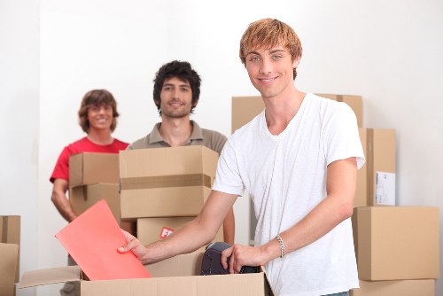 Office relocation equipment and packed boxes ready for transport in Belsize Park