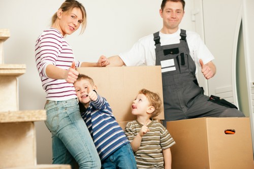 Loading furniture and boxes into a removal van near Belsize Park